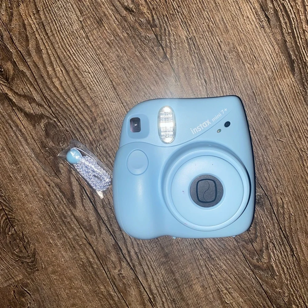 Baby Blue Polaroid Camera with photo book, film, and etc.